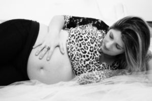 pregnant woman laying on her left side